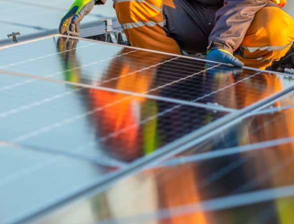 Someone installing solar panels