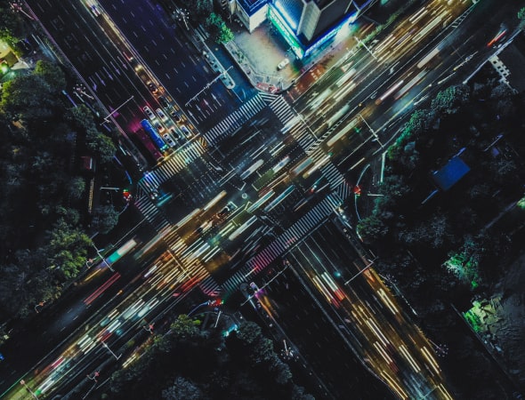 aerial view of a crossroads, nighttime setting