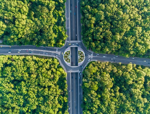 aerial view of a roundabout in a verdant setting